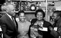 image of San Francisco Mayor Willie Brown with members of We Are Family, Cynthia Alexis, Agnes Morton, and Tress Stewart